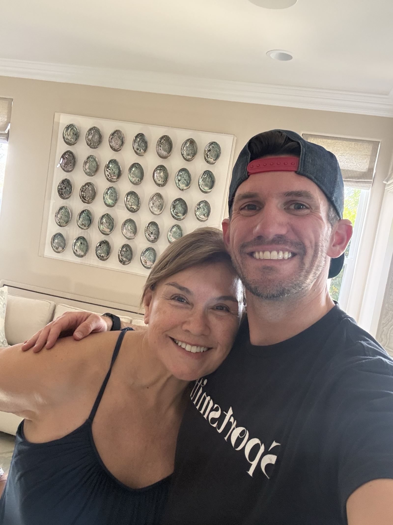 David from Kinetix Physio embracing a longtime client, reflecting the multi-year relationships behind the practice's retention